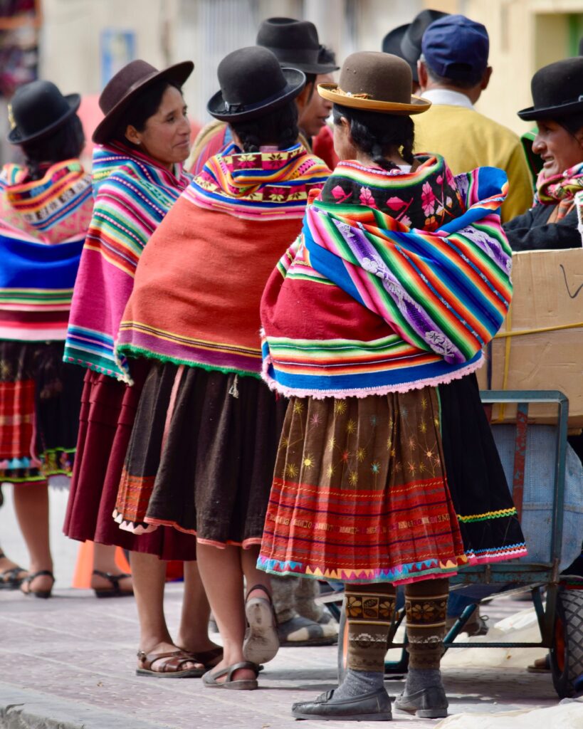 Bolivia women dressed in tradiotional clothing: the real colours of Bolivia Bolivia trip: The colourful traditional clothing